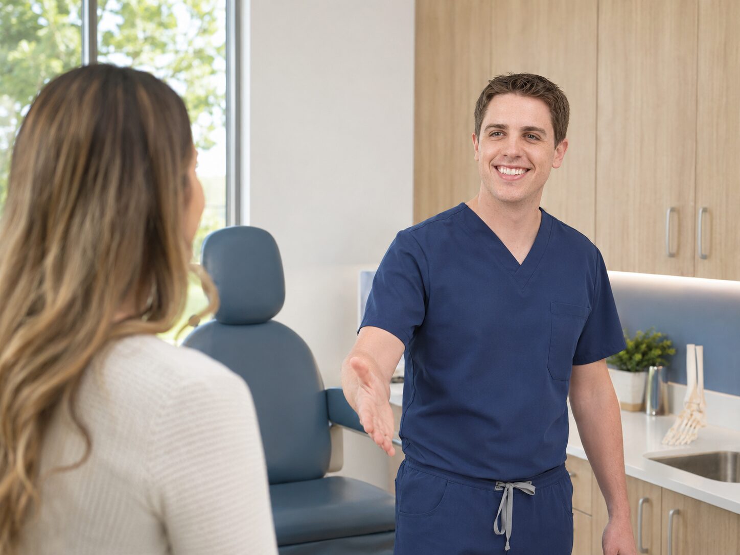Dr. Boehm greeting a new patient in a TSB Podiatry consultation room